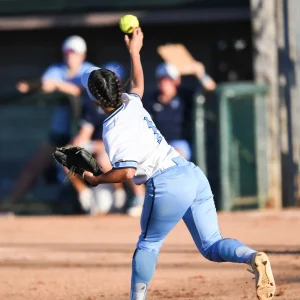 High School Softball Players making plays during a game